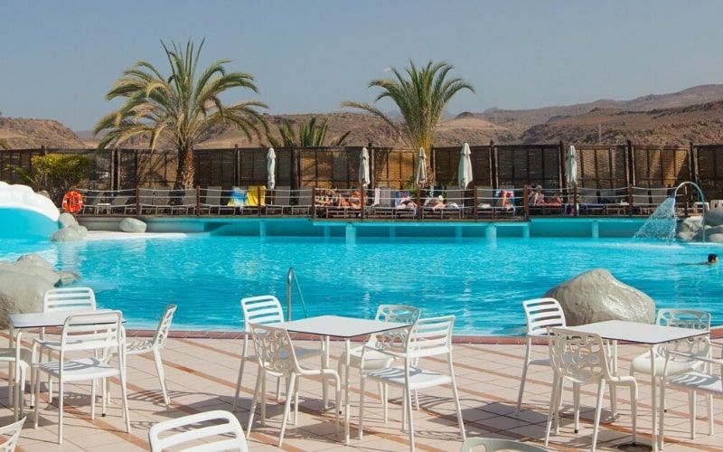 outdoor poolside seating at the Abora Continental Hotel, Gran Canaria.