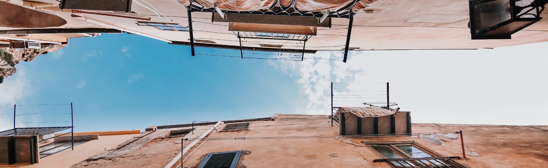alleyway looking up at the blue sky