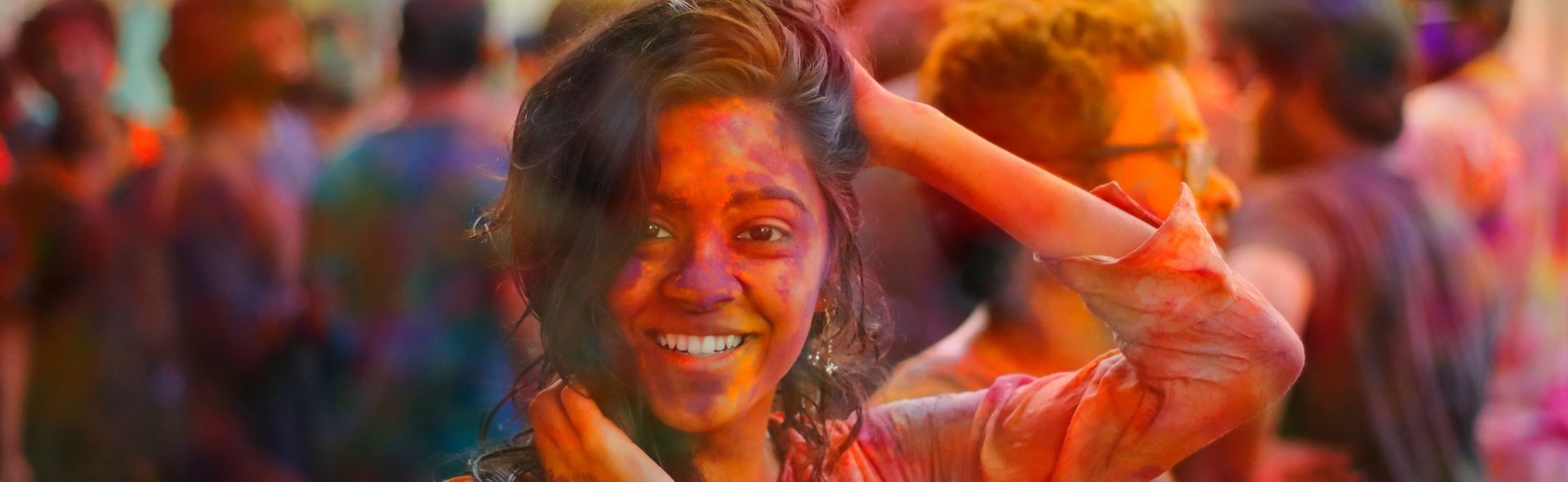 crowd taking part in a Holi Festival