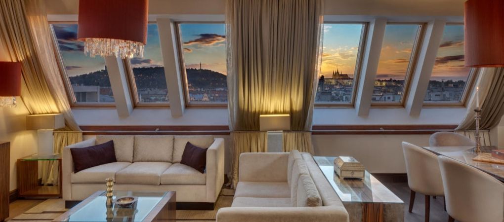 spacious living room with large windows to witness the sunset