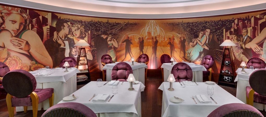 large restaurant with a beautiful wall mural