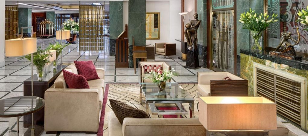 hotel lobby with an assortment of seating options and sculptures to enjoy