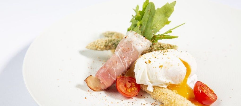 poached egg breakfast with some bacon