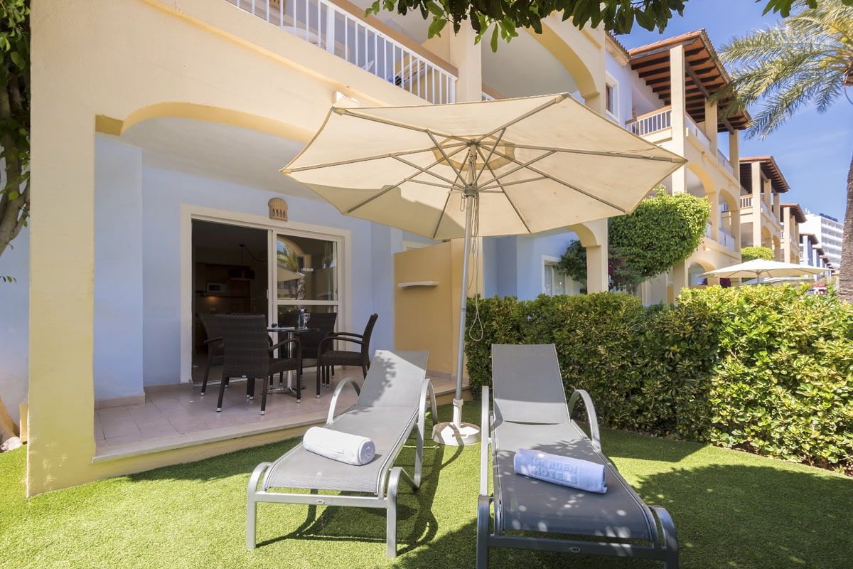 Sunbeds provided near your hotel room terrace at Alcudia Garden Aparthotel