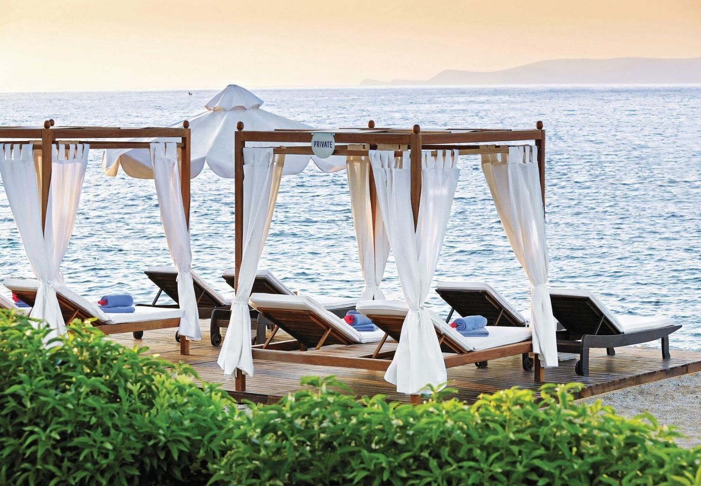 luxury sunbeds offering a view of the ocean