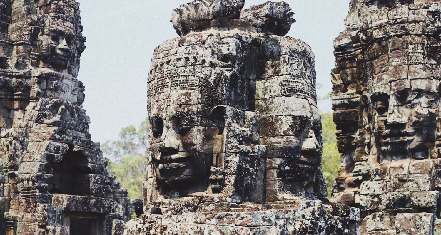 stone architecture with smiling faces