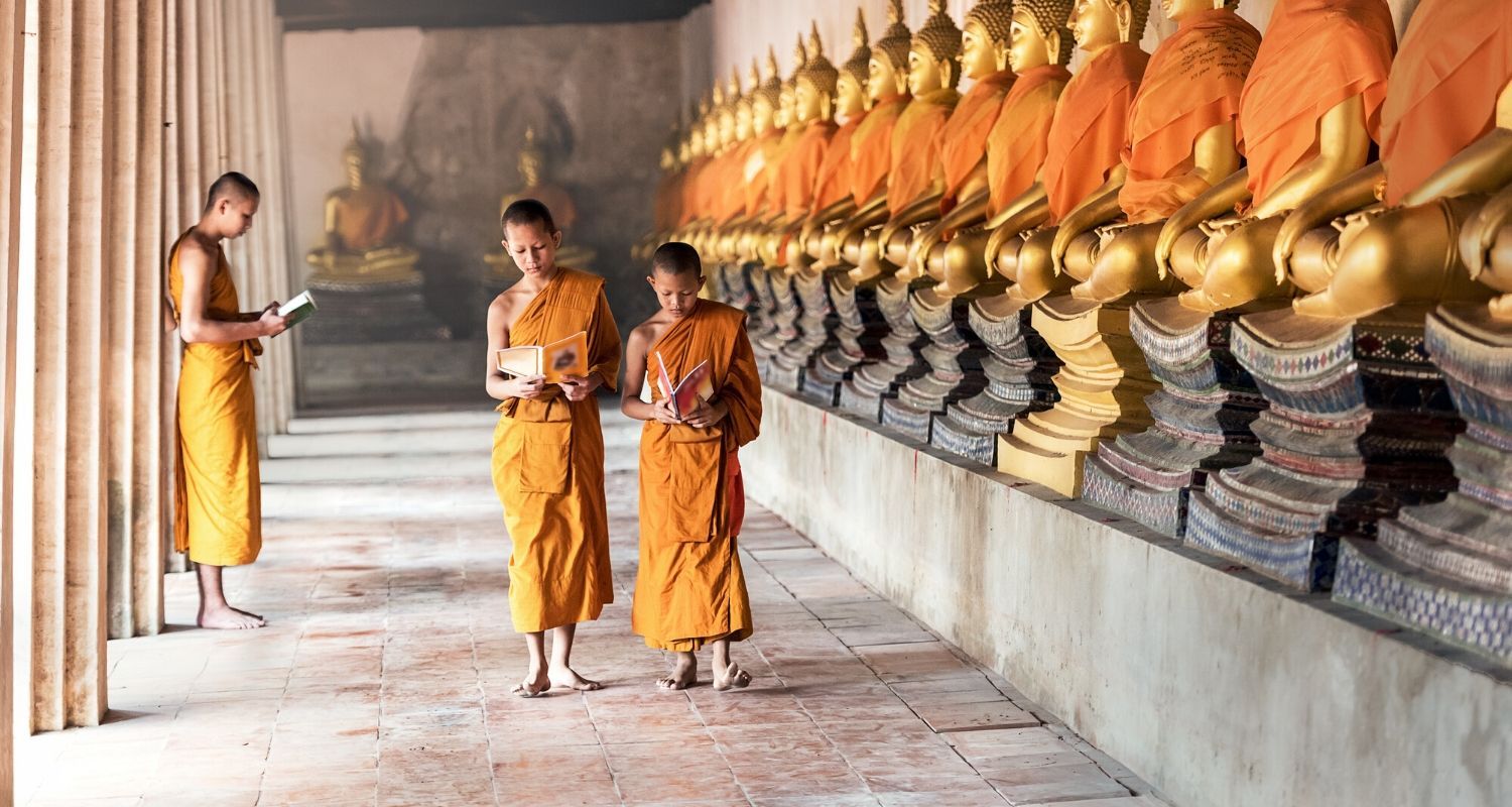 Buddhist monks walking around the grounds
