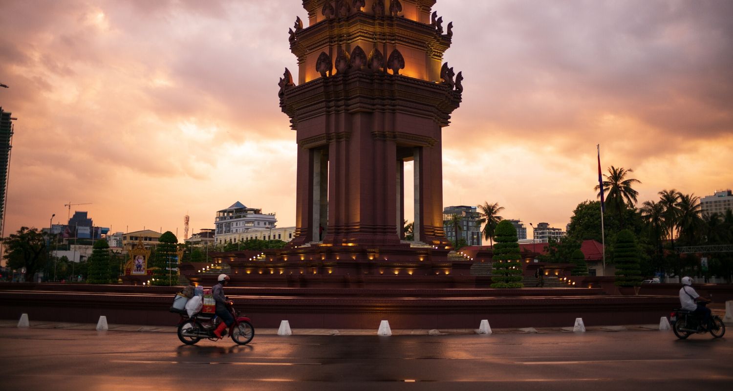 moped circling pagoda roundabout
