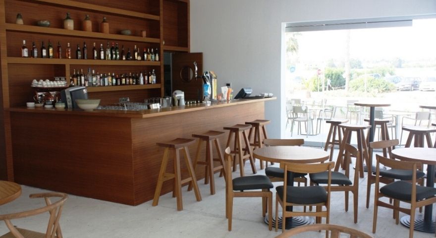 indoor hotel bar with a view of the green