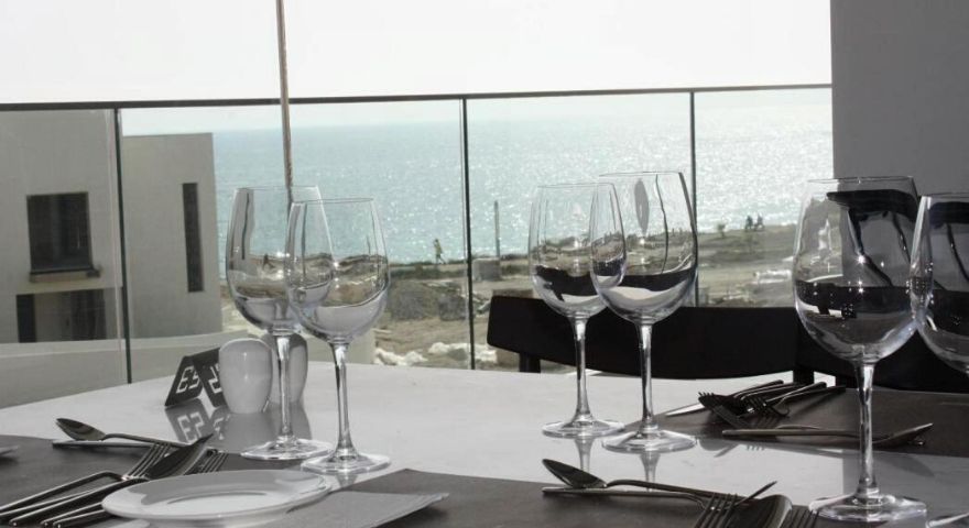 indoor dining room with a view of the ocean