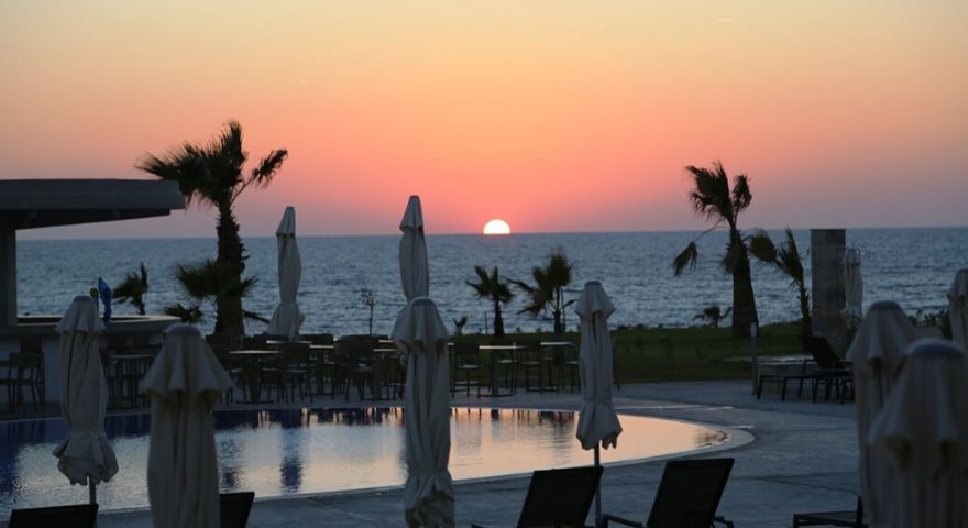 the sun is about to disappear from the sky as the day concludes