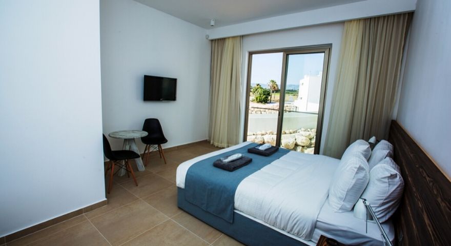 spacious double bedroom with sliding glass doors