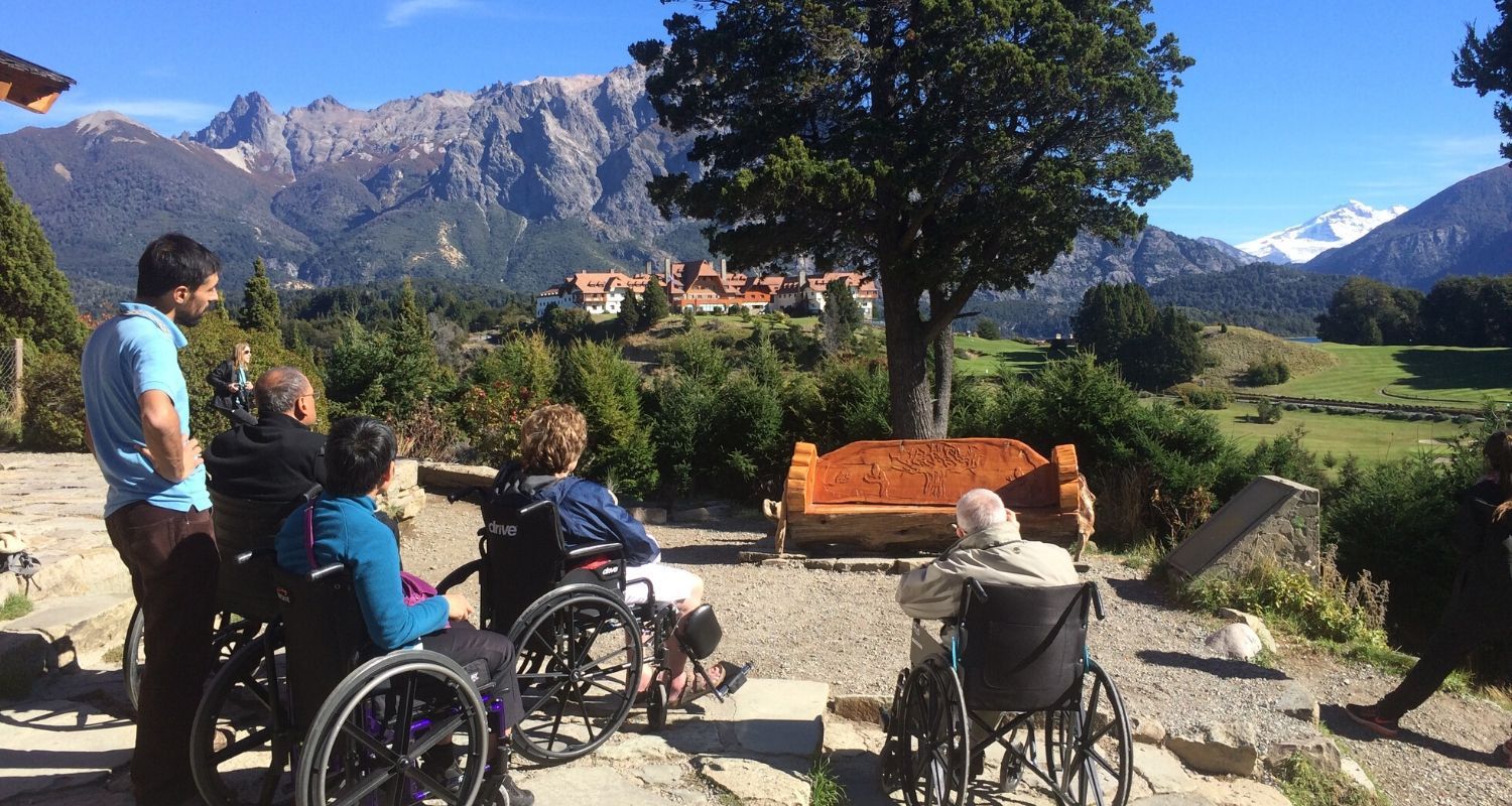view of an open field and large house