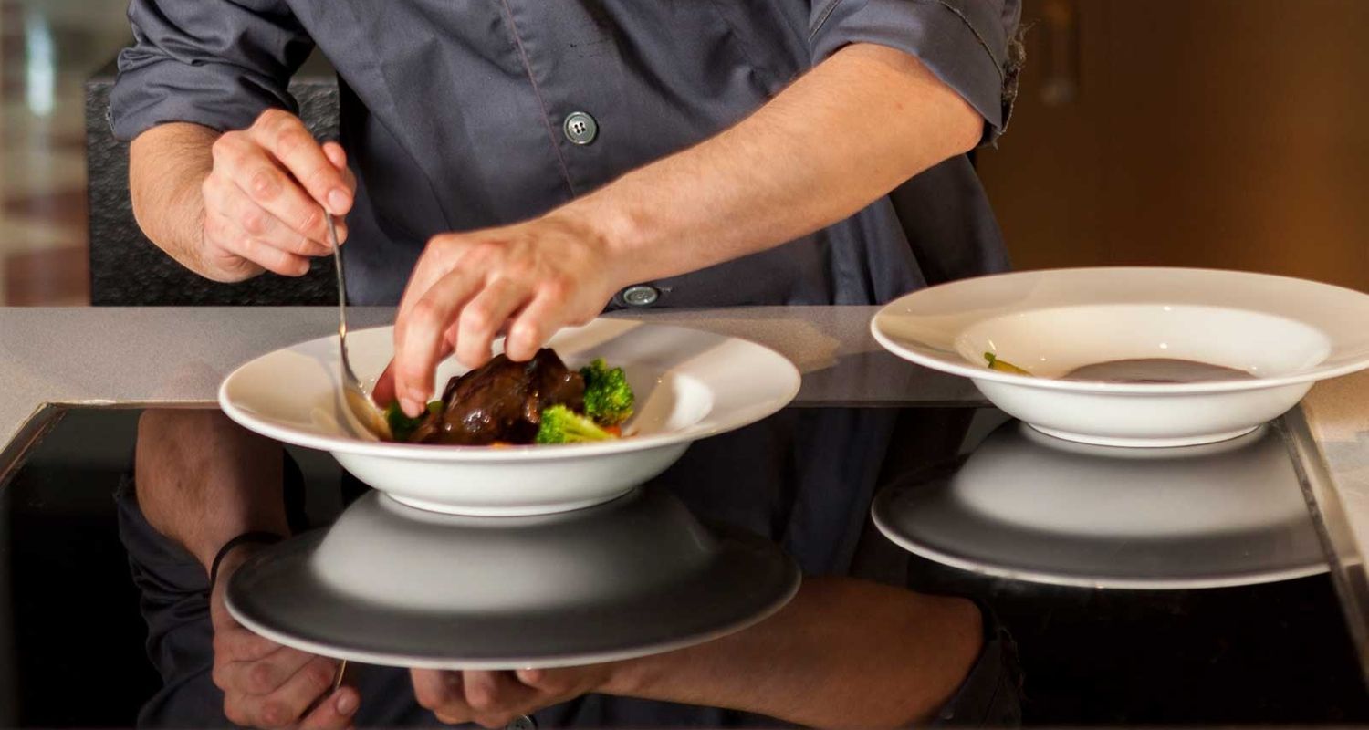 dining prep with hands on attention from the chef