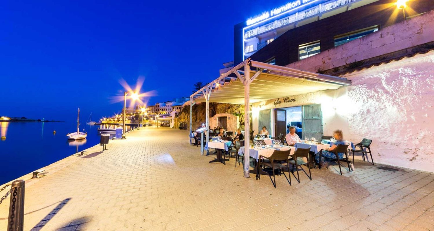outdoor restaurant and view of the hotels name