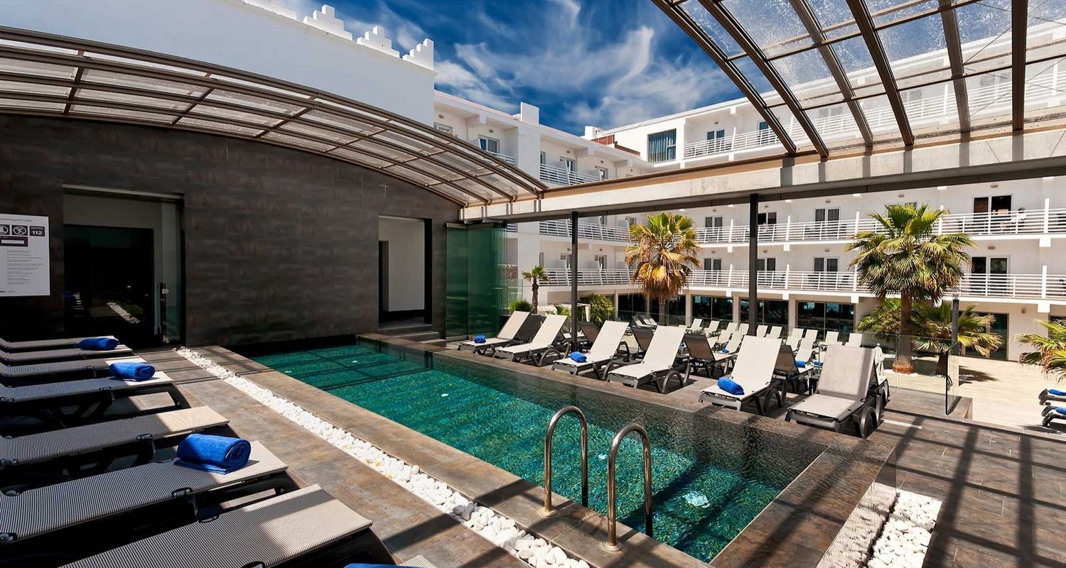 rooftop swimming pool offering shaded seating