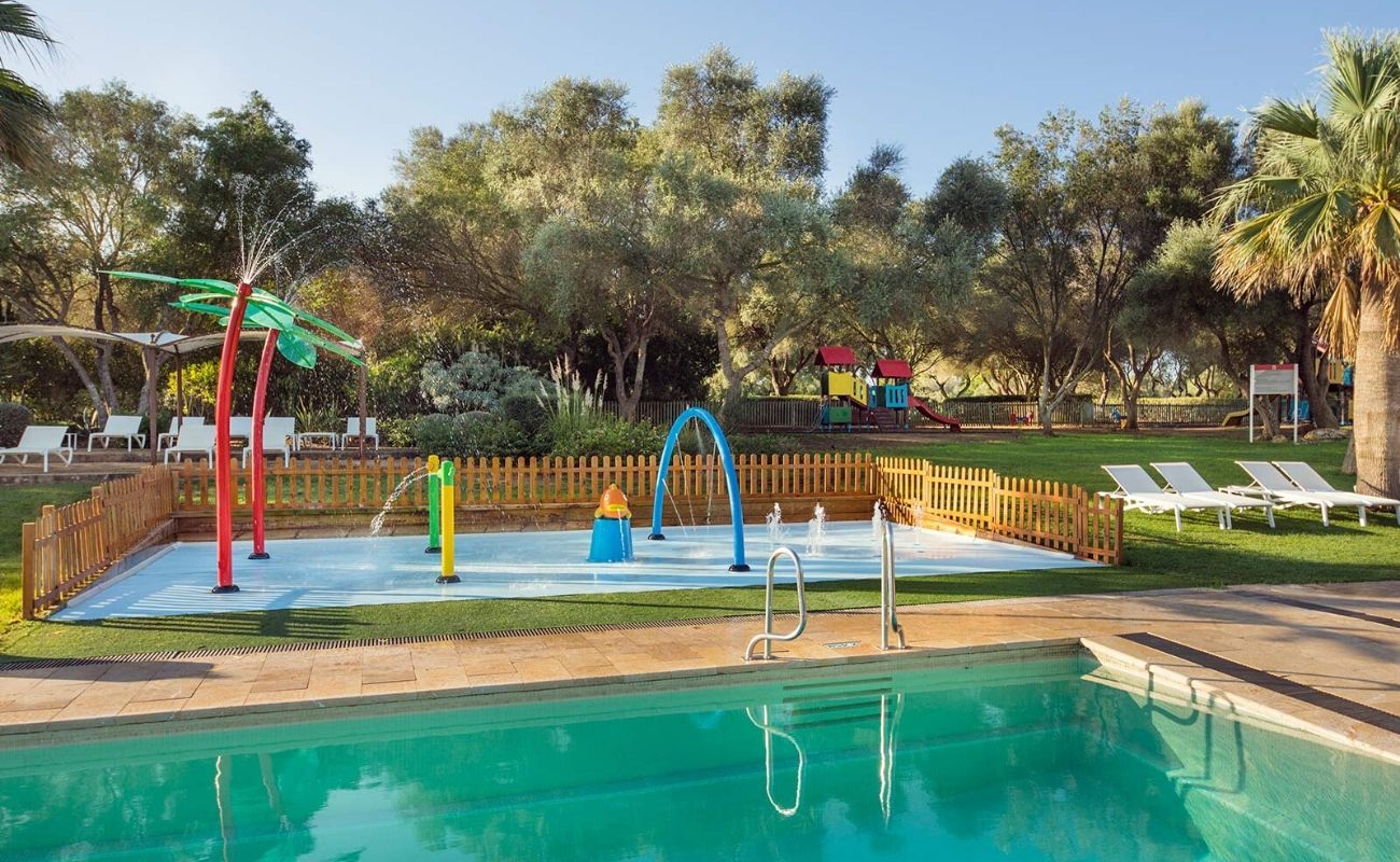 outdoor swimming pool and kids water play area