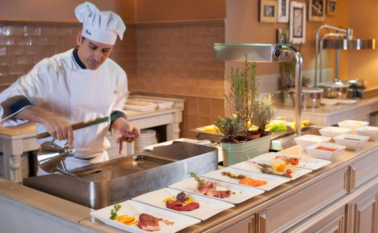 professional chef preparing food for hotel guests