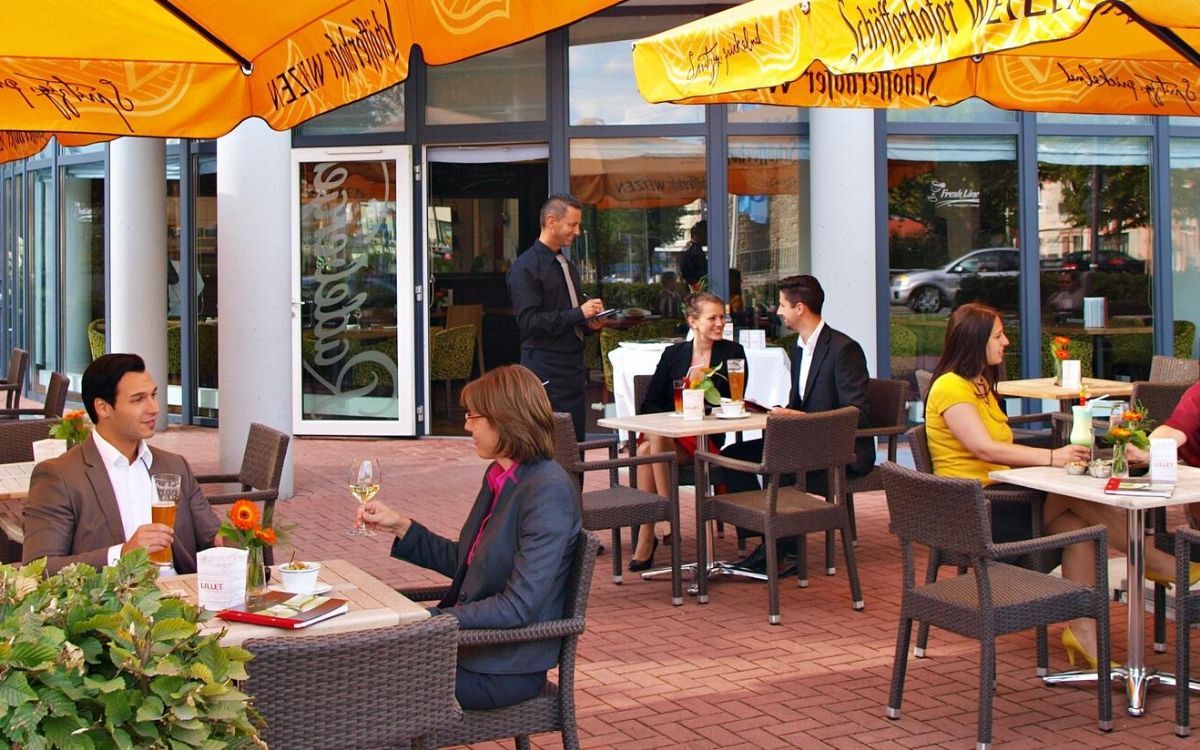 outdoor dining area near the hotel entrance