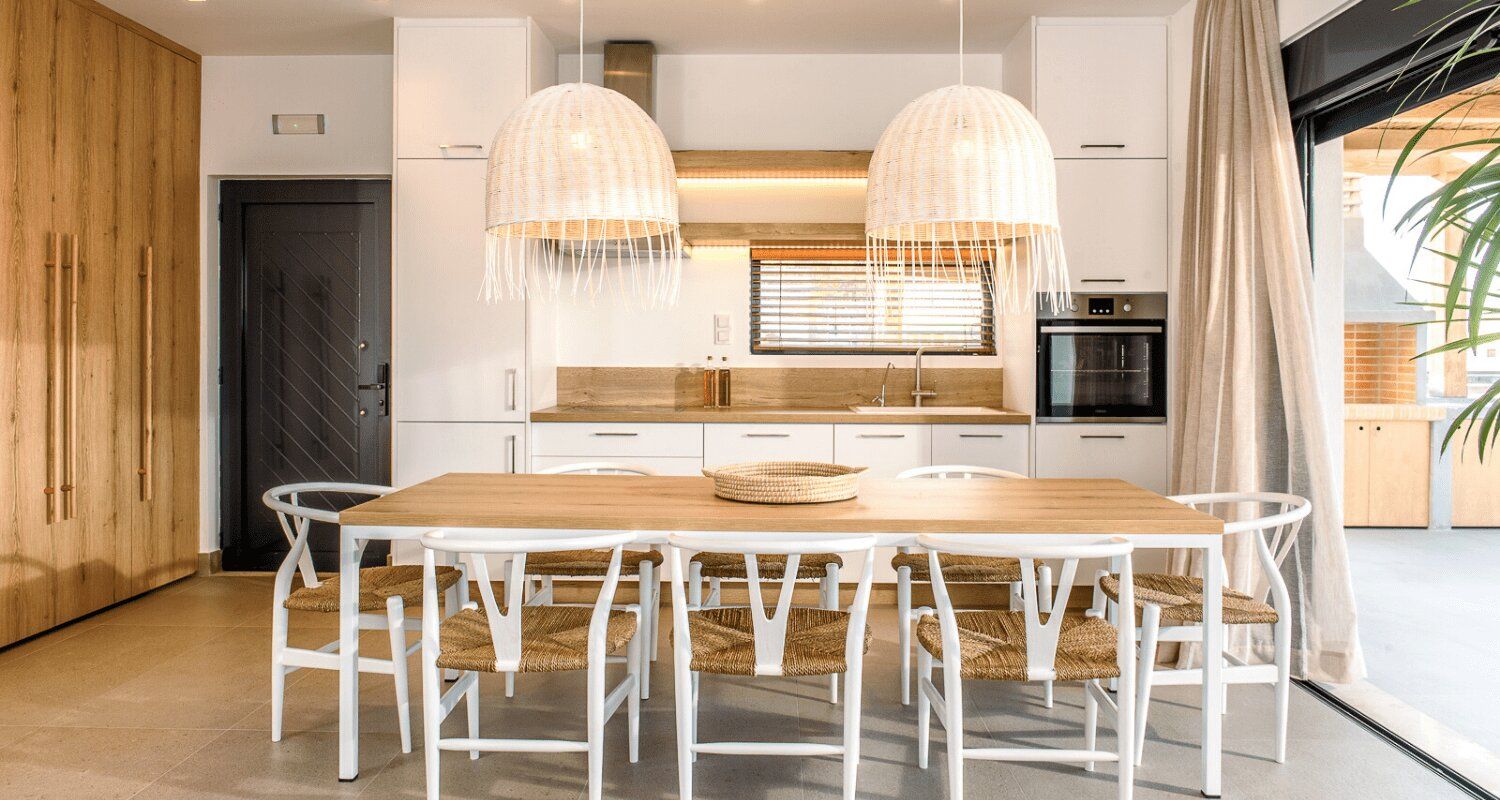 fully furnished kitchen with a dining table