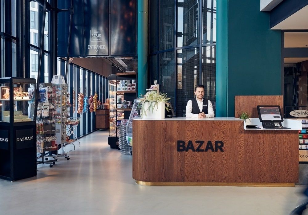 24/7 lobby shop with a friendly staff member behind the front desk