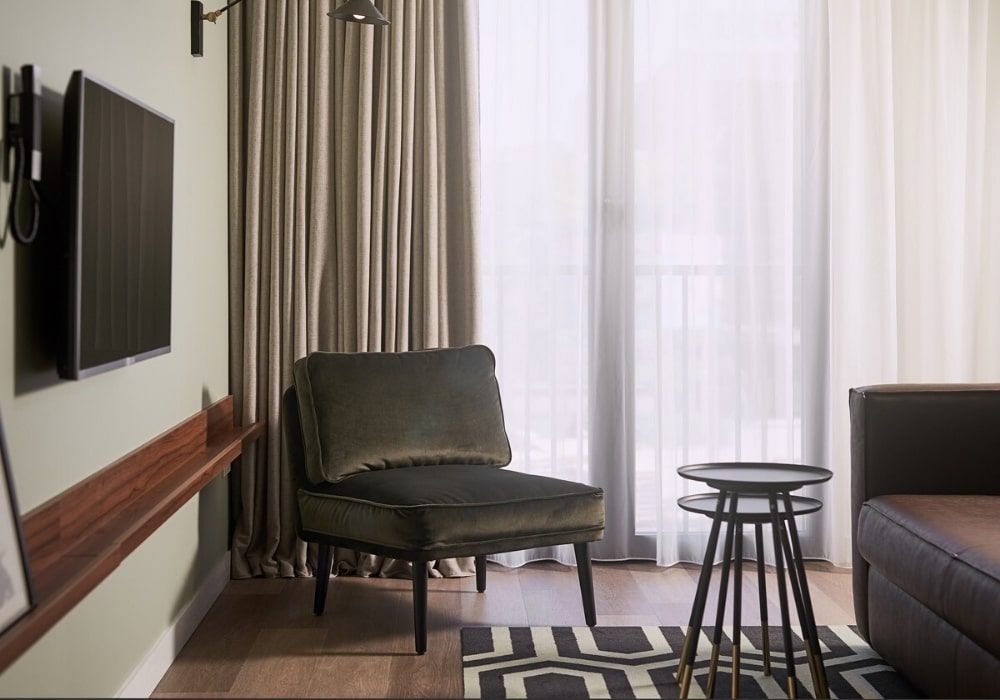 apartment living room with a wall mounted flat screen tv