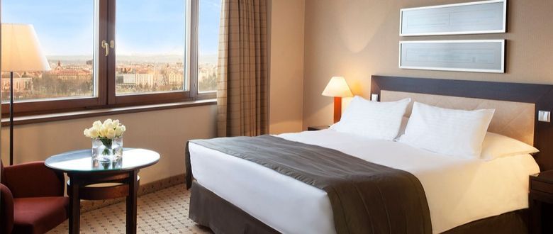 bright and spacious hotel room with a queen sized bed