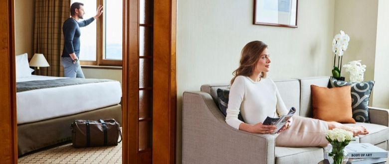 a couple enjoying the room and the views that it has to offer