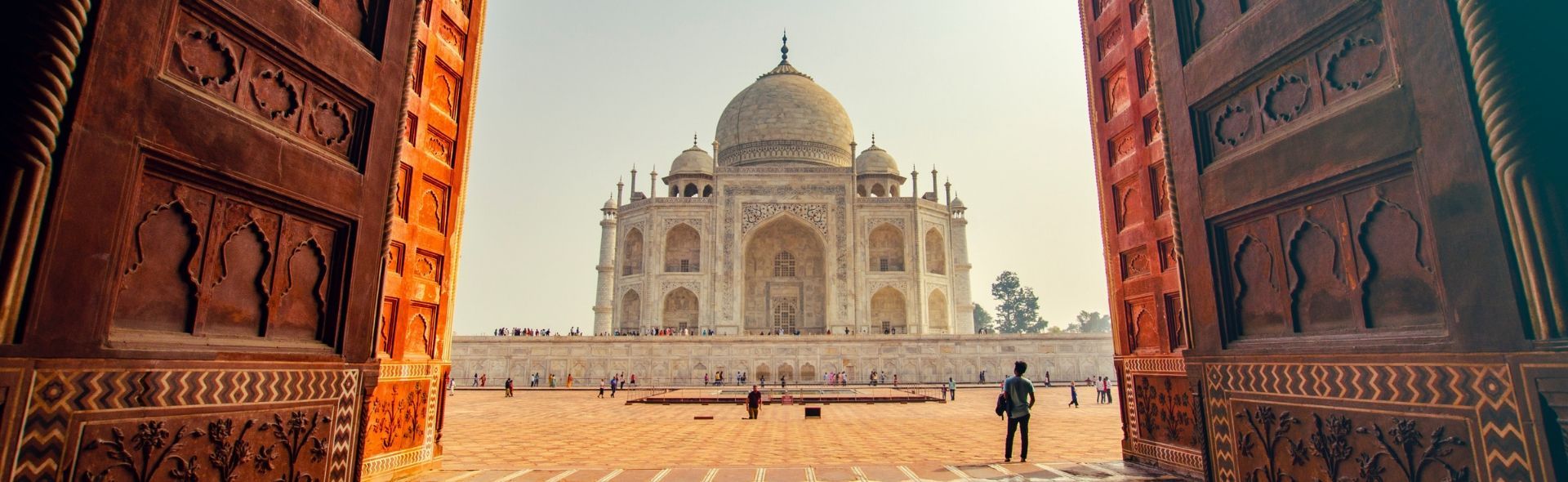 doors opening to show the Taj Mahal