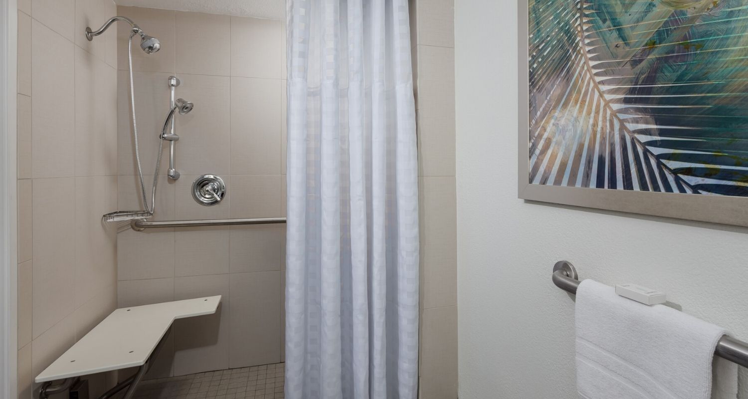 Wheel-in shower with a built in shower chair/bench