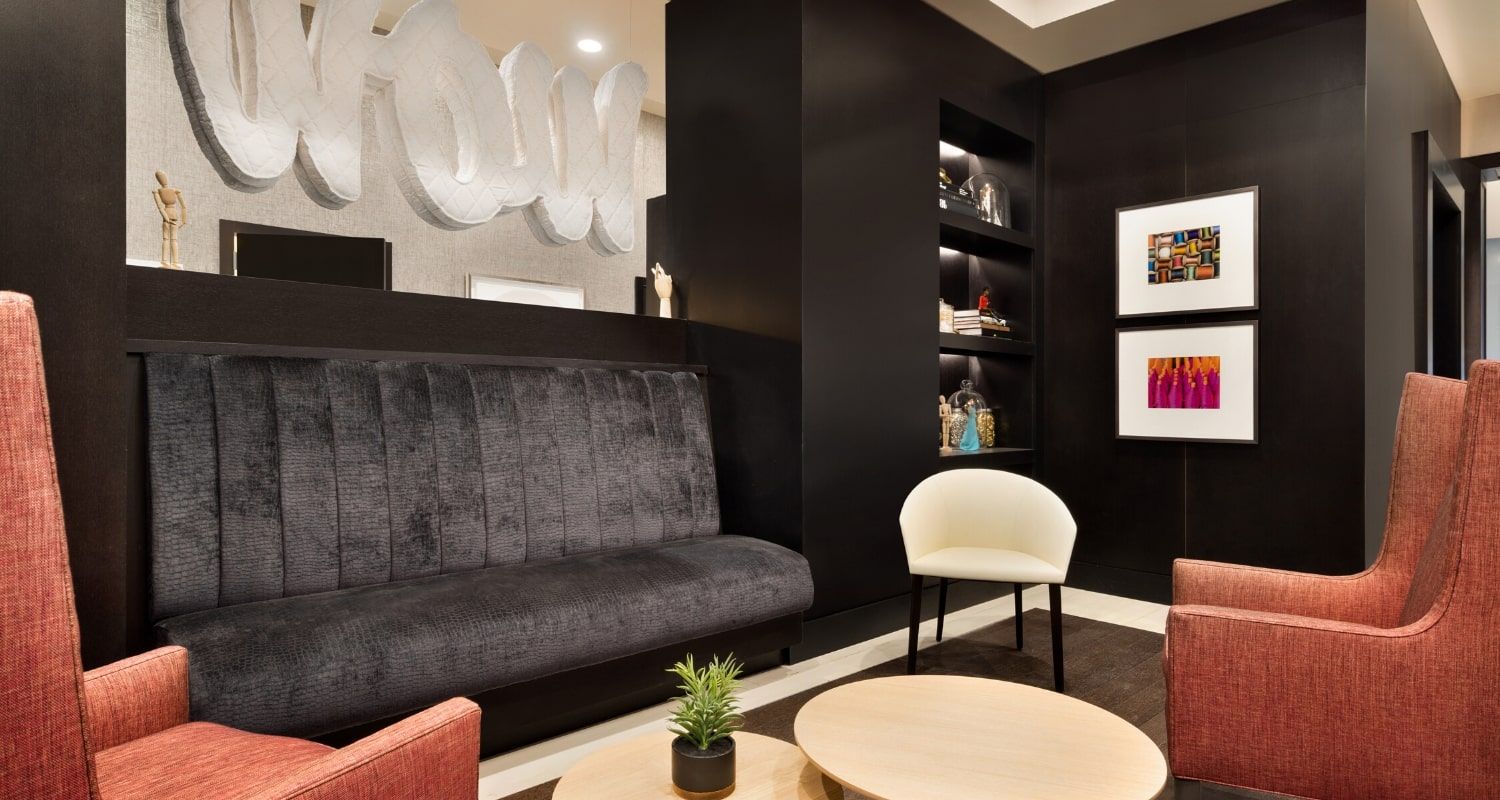 indoor lounge area with a wow sign