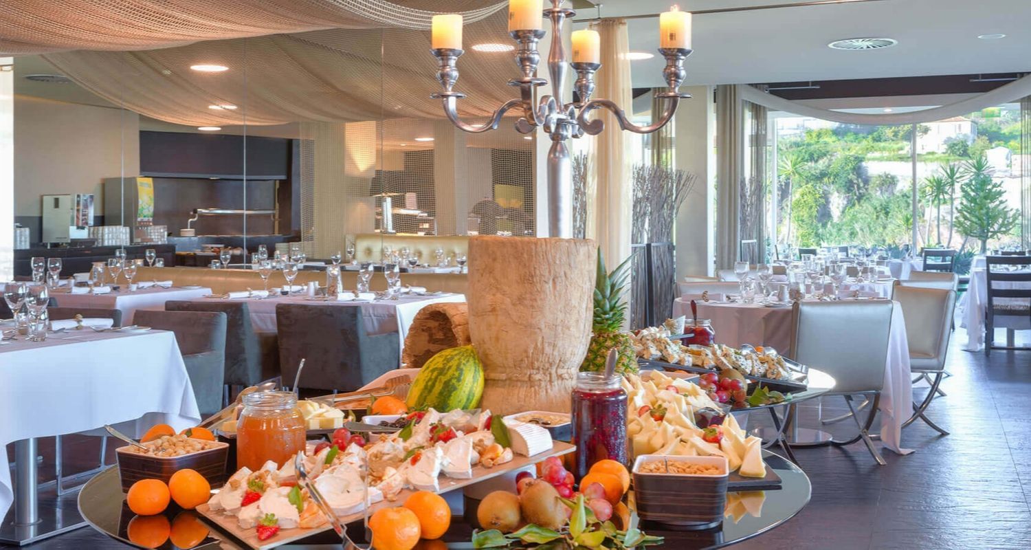 indoor buffet with a selection of food, including fruit