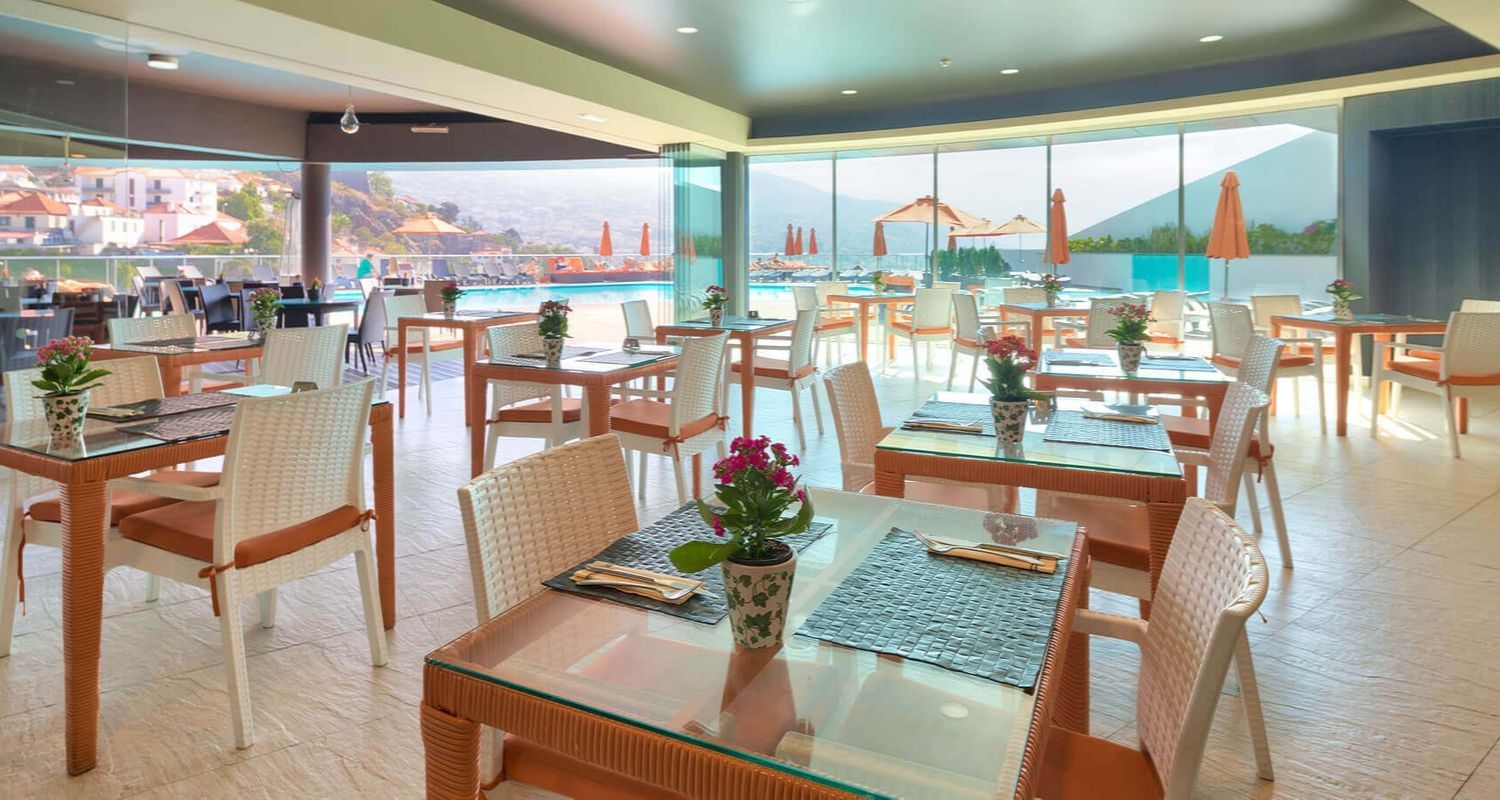 indoor restaurant near the outdoor swimming pool