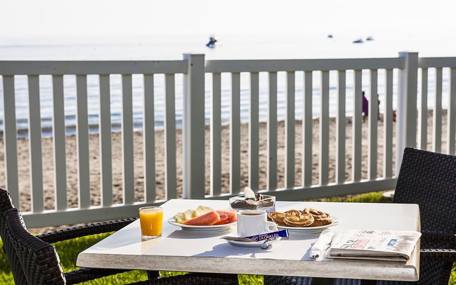outdoor dining area with a view of the ocean