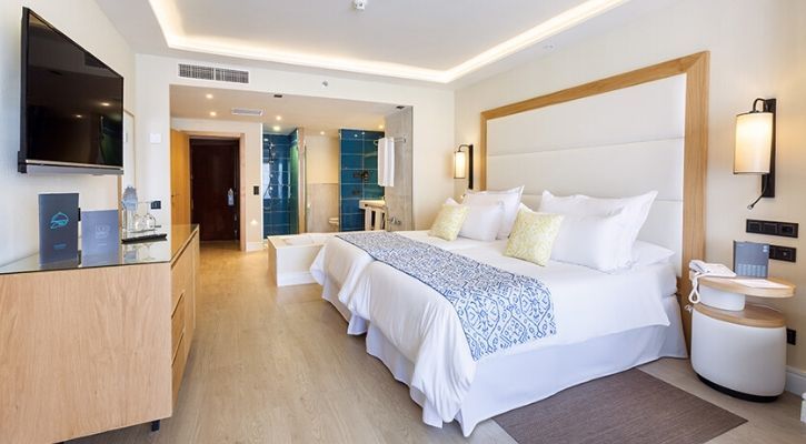 spacious bedroom with a view of the adapted bathroom