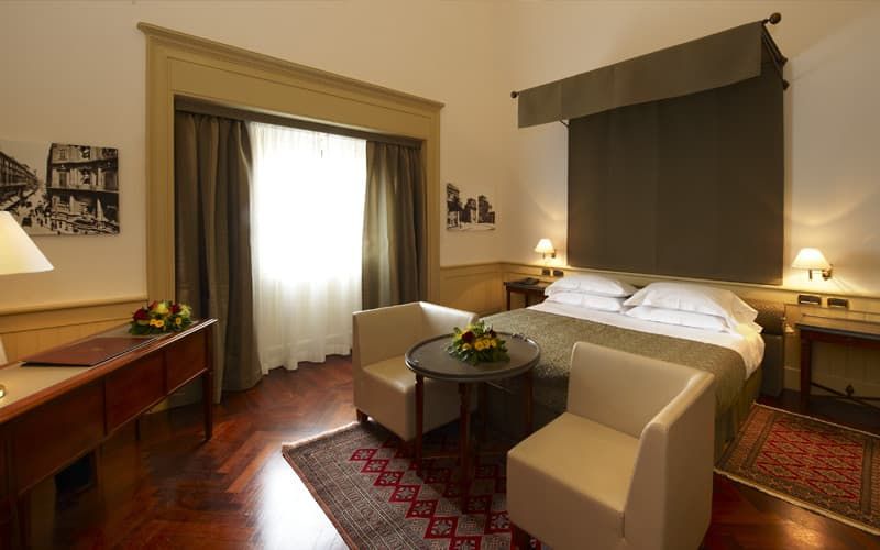 spacious bedroom that offers a lot of light