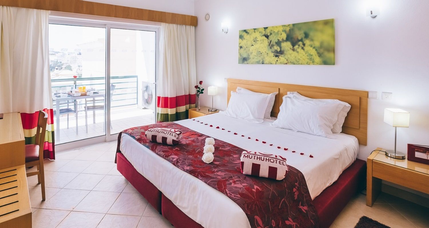 large bedroom with a balcony terrace