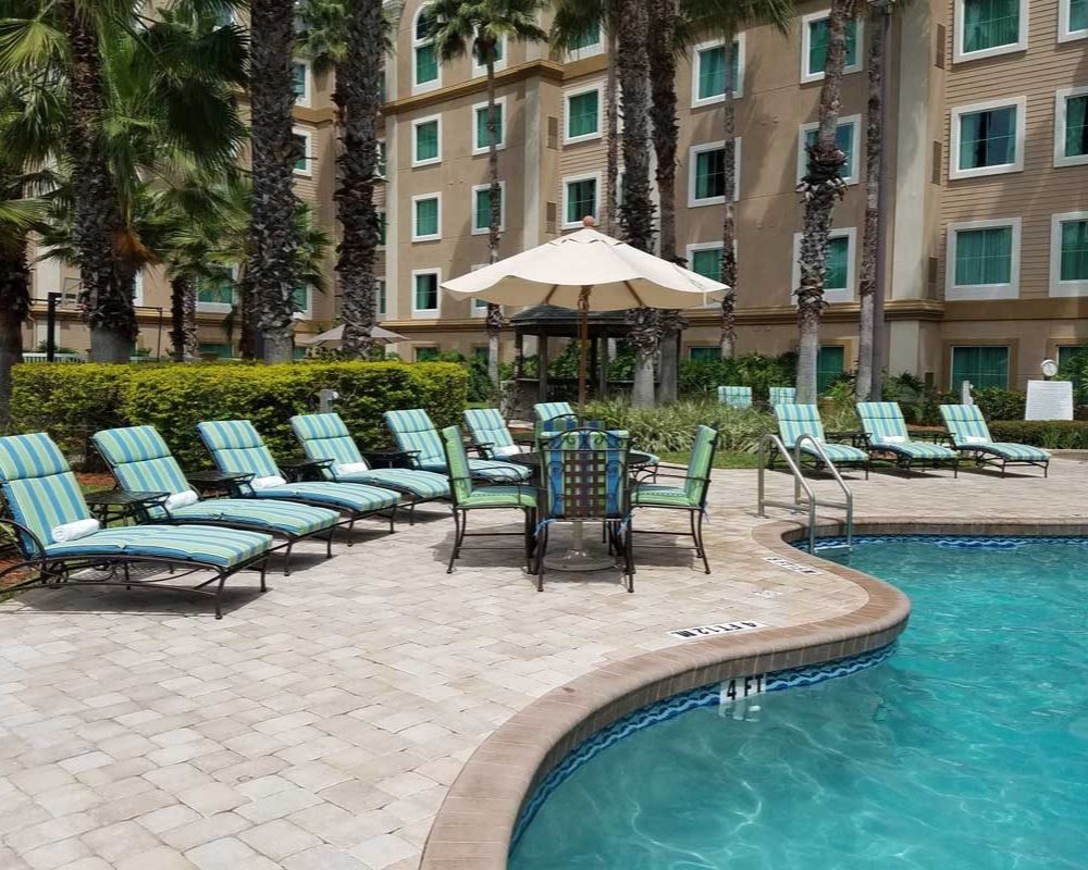 outdoor swimming pool with sunbeds