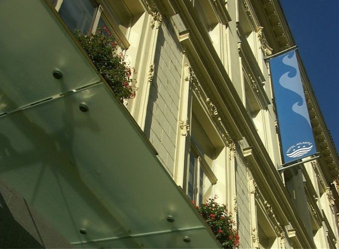 hotel exterior showing a sign with its name