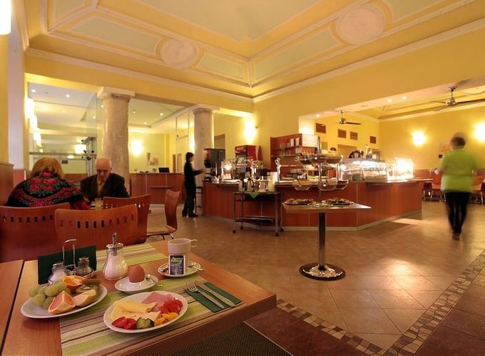 indoor restaurant with hotel guests eating and taking a stroll