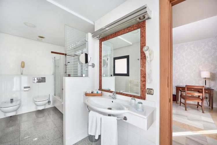 spacious bathroom with a wheel-in shower