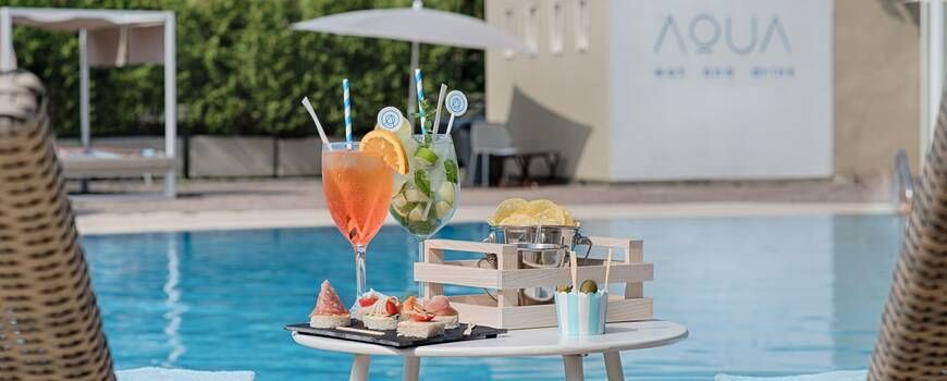 outdoor dining area next to the pool