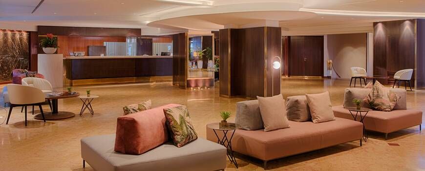spacious and welcoming hotel lobby with a view of the check-in desk