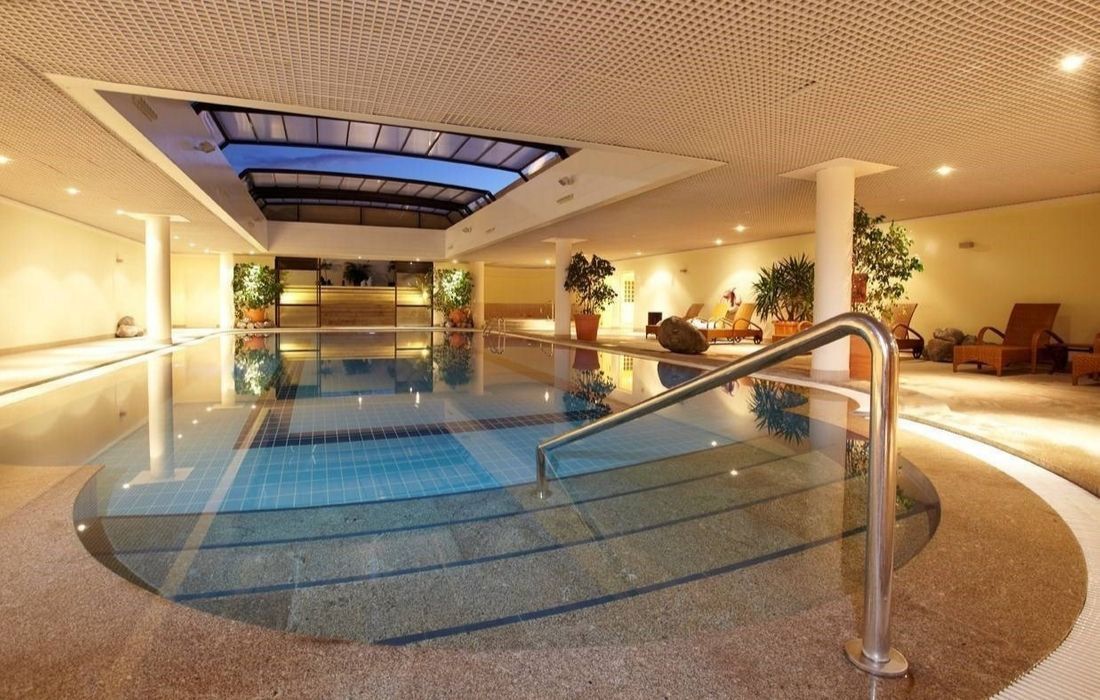 indoor swimming pool with a grab rail