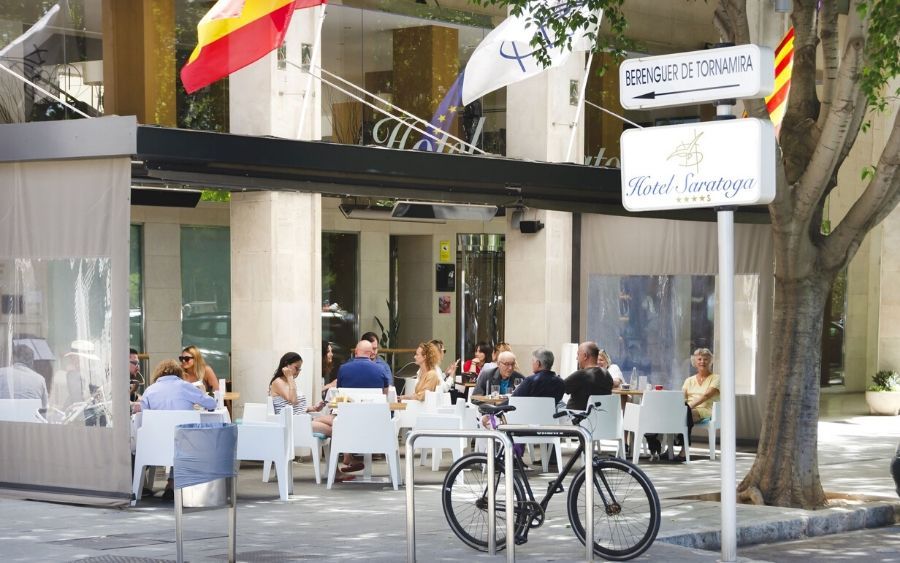 outside of the Hotel Saratoga looking at the exterior and outdoor seating area