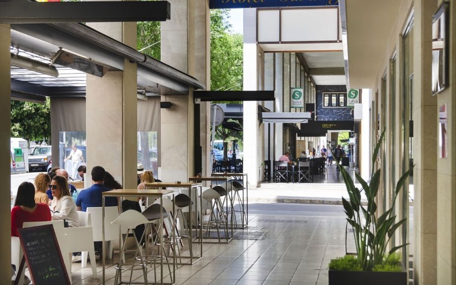 peering down a hallway leading inside the hotel