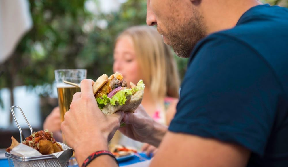 family eating delicious cheeseburgers