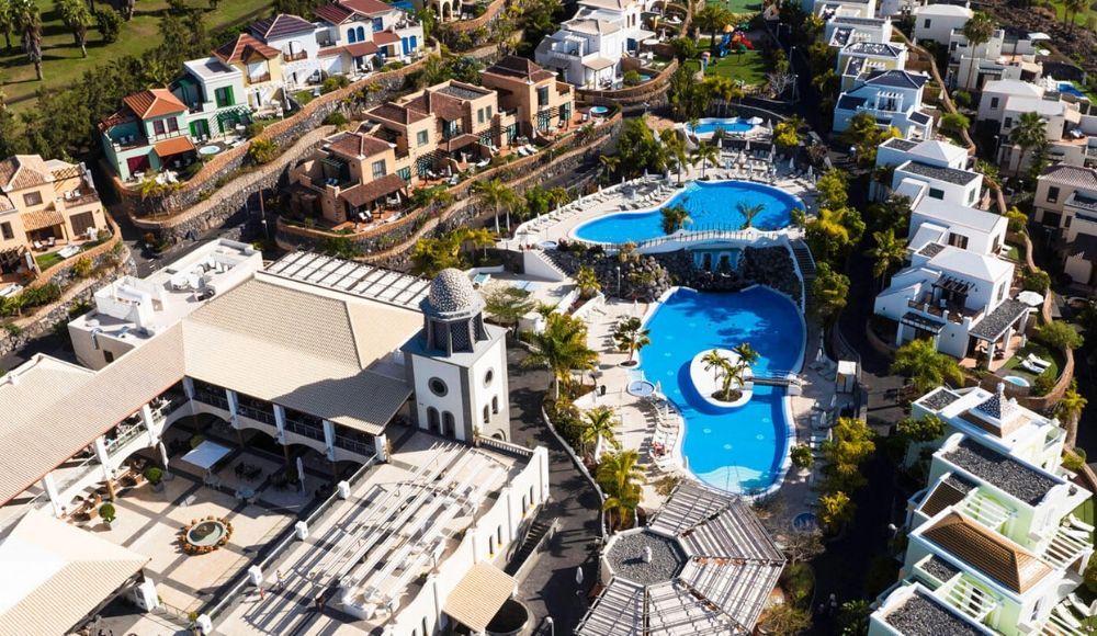 aerial view of the hotel grounds with a view of the villas and outdoor swimming pool