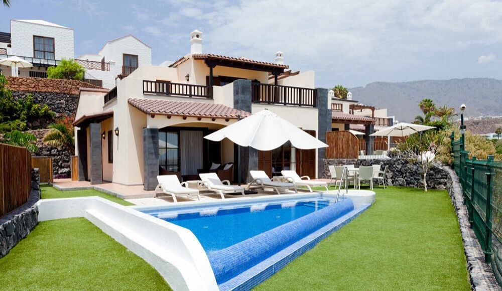the outdoor pool sitting in front of the villa