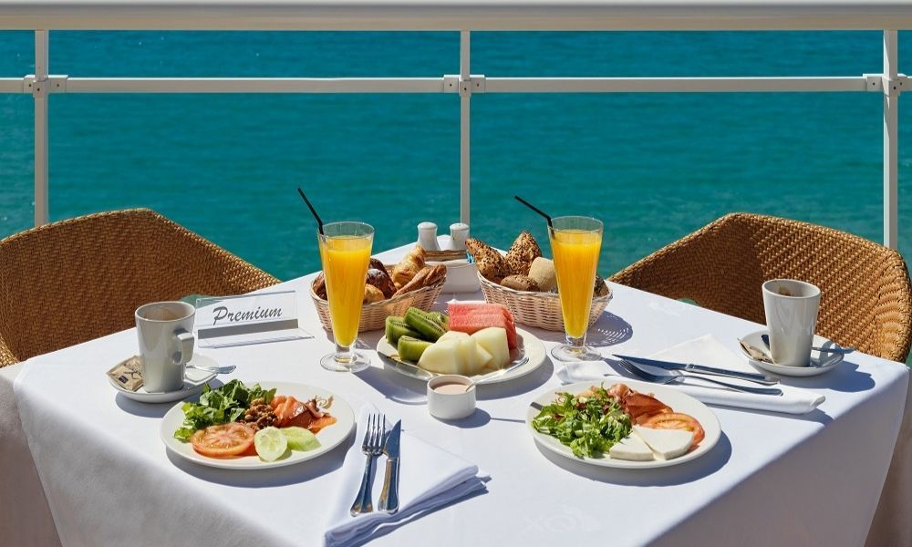 dining table with lunch and orange juice